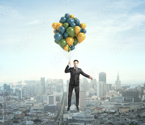 Photo: businessman flying businessman flying