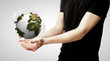 hands holding earth