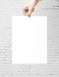 Photo: hand holding paper hand holding paper