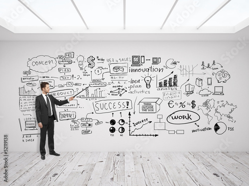 Photo: man pointing at business concept man pointing at business concept