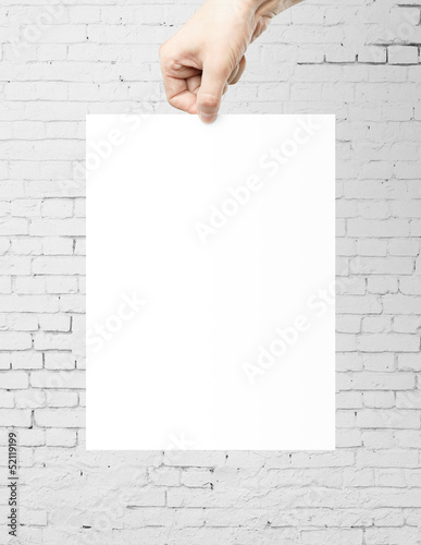 Photo: hand holding paper hand holding paper