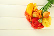 Ranunculus (persian buttercups), on white wooden background