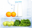 Open refrigerator with vegetarian food