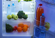 Open refrigerator with vegetarian food