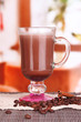 Layered coffee in glass on table on bright background
