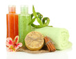 Bottles with scrub and hand-made soap, isolated on white