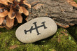 Fortune telling  with symbols on stone close up