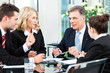 Foto: Business people - meeting in an office Business people - meeting in an office