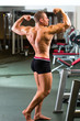 Photo: Bodybuilder posing in Gym Bodybuilder posing in Gym