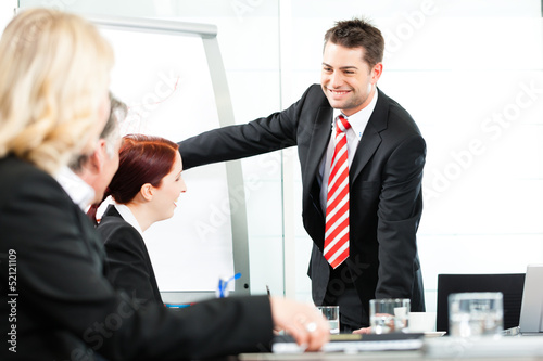 Photo: Business - presentation within a team Business - presentation within a team
