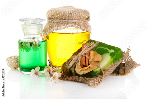 Photo: Hand made soap and ingredients for soap making, isolated Hand made soap and ingredients for soap making, isolated