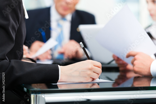 Photo: Business meeting with work on contract Business meeting with work on contract