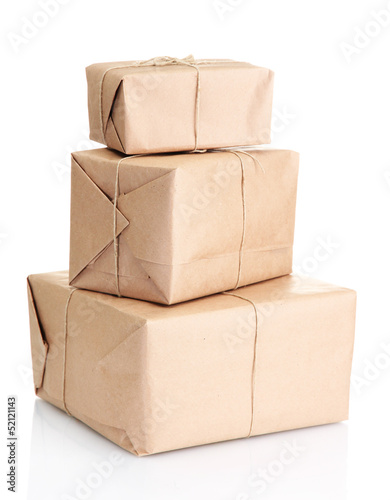 Photo: parcels boxes with kraft paper, isolated on white parcels boxes with kraft paper, isolated on white