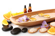 Beautiful spa setting with flowers and orange, isolated on