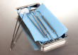 Dentist tools on grey table close-up