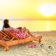 Couple in hug watching together sunrise over Red Sea in Egypt