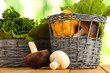 Useful herbs on wooden table on nature background