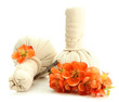 Herbal compress balls for spa treatment and flowers isolated