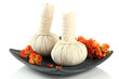 Herbal compress balls for spa treatment and flowers isolated