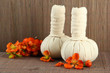 Herbal compress balls for spa treatment on bamboo background