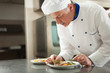 Chef garnishing a dish