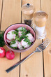 Vitamin vegetable salad in bowl on wooden table close-up
