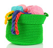 Photo: Colorful yarn for knitting in green basket isolated on white Colorful yarn for knitting in green basket isolated on white