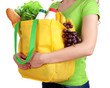 Girl with shopping bag isolated on white