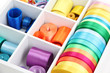 Bright silk ribbons in white wooden box, close up