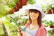 Photo: Cheerful Florist with Flowers Cheerful Florist with Flowers