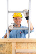 Photo: Carpenter With Ladder and Hammer Carpenter With Ladder and Hammer