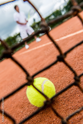 Photo: Tennis player playing a match Tennis player playing a match