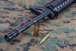 M4A1 carbine with cartridges on us marines camouflage uniform
