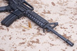 assault rifle with cartridges on us marines camouflage uniform