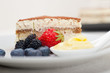 tiramisu dessert with berries and cream