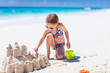 Little girl playing at beach