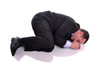 businessman in fetal position