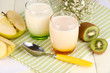 Delicious yogurts with fruits in glasses