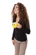 Woman laughs while holding a coffee cup with a smiley face on it