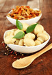 Mushrooms in bowls, on wooden background