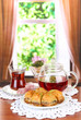 Sweet baklava on plate with tea on table in room