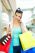 Photo: Woman holding credit card and cell phone, shopping Woman holding credit card and cell phone, shopping