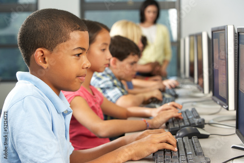Photo: Elementary Students Working At Computers In Classroom Elementary Students Working At Computers In Classroom