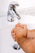 man washing his hands