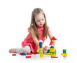 Photo: child girl playing with block toys over white background child girl playing with block toys over white background