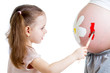 cute kid girl painting mother's belly