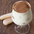 Tiramisu cake on a wooden table