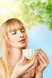 Foto: Woman with herbal tea Woman with herbal tea
