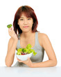 Photo: Isolated young asain woman with a bowl of vegetable salad Isolated young asain woman with a bowl of vegetable salad