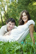 Pregnant wife and her husband touching her belly